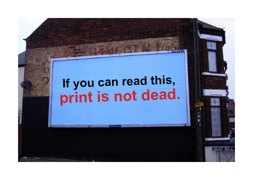 Billboard saying 'print is not dead.'