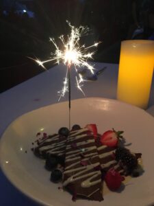 Sparkler on a slice of birthday cake