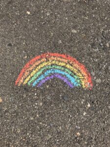 Rainbow created in chalk on pavement