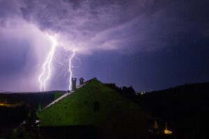 A dark night with storm clouds and lightning