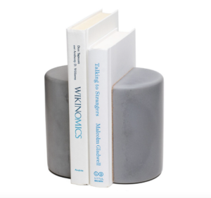 Concrete bookends support two books.