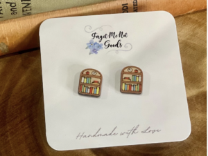 A pair of earrings that resemble a shelf of books.