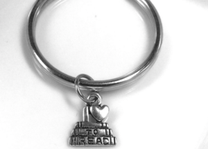 Stainless steel keychain with a "stack of books" charm