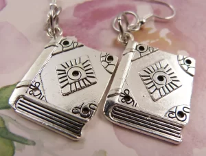 Silver books as earrings.