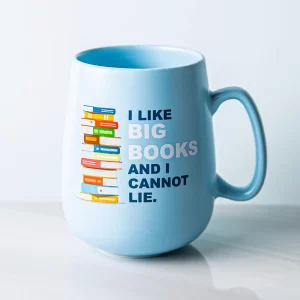 Blue mug with an image of a stack of books and text, "I like big books and I cannot lie."